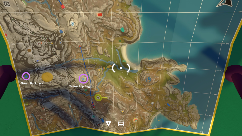 The handheld map marked with a Yellow Hip Bag and Green Backpack in the eastern mountain area