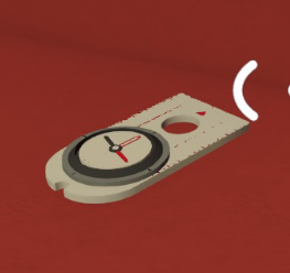 A portable Big Walk compass lying on a table