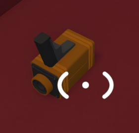 A small orange Big Walk item scanner with a dark viewfinder