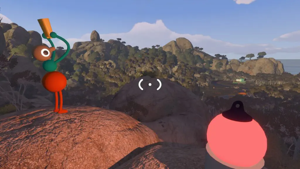 Two Big Walk players stand far apart on separate rocks overlooking the island