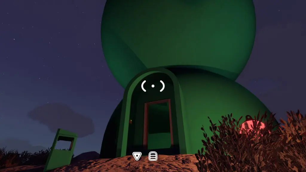 The green control-panel tower with its key doorway at night