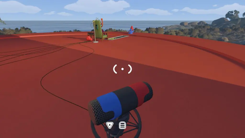 A close view of one colour-banded microphone facing the distant listening chair