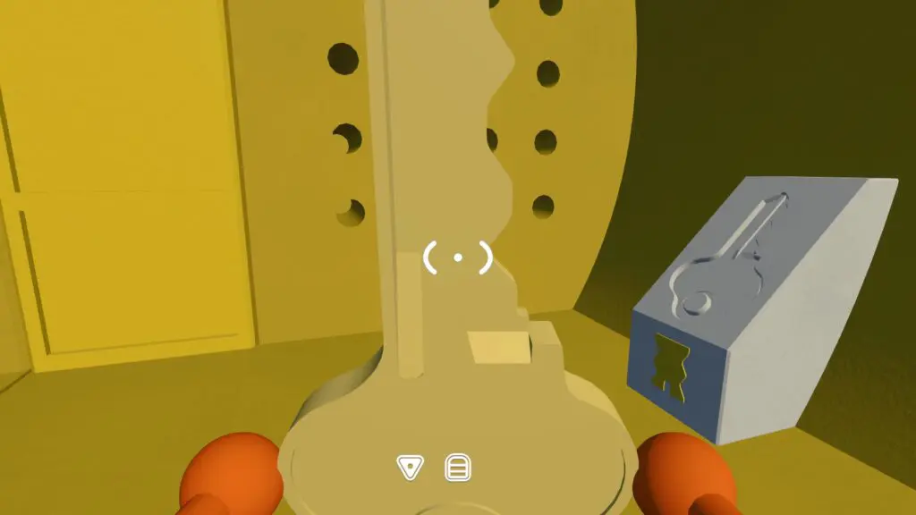 The fully shaped yellow key matches the lock beside the perforated tunnel doors
