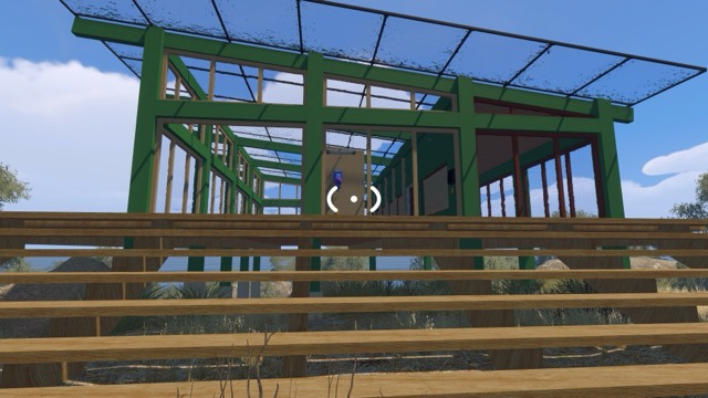The green glasshouse-style Greenhouse puzzle building above the beach