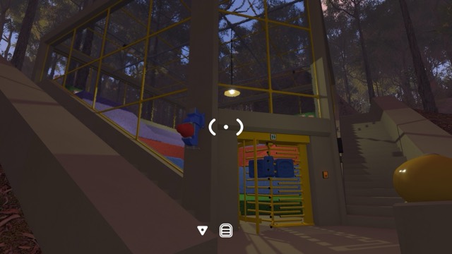 A coastal hillside puzzle building has a yellow turnstile at its entrance
