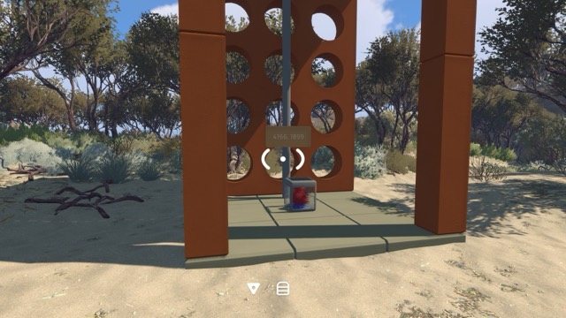 A brown tower-like puzzle structure stands in the middle of a forest