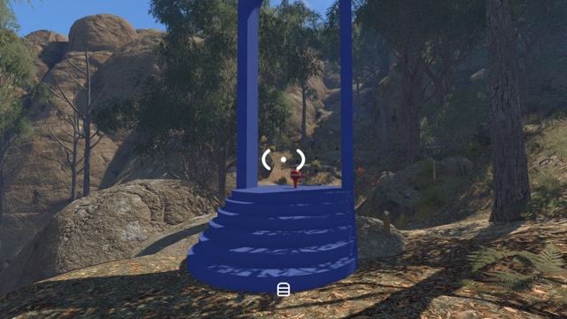 The shared Golf Tee start station, with a blue upright frame and a short stepped base among trees